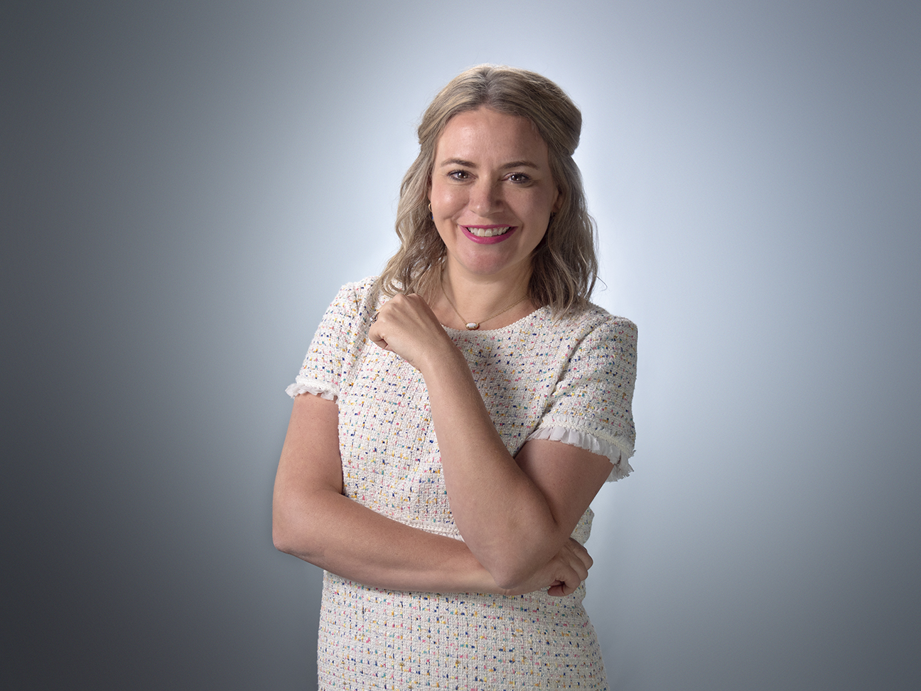 Headshot of Dawn Hawkins, smiling with arms crossed