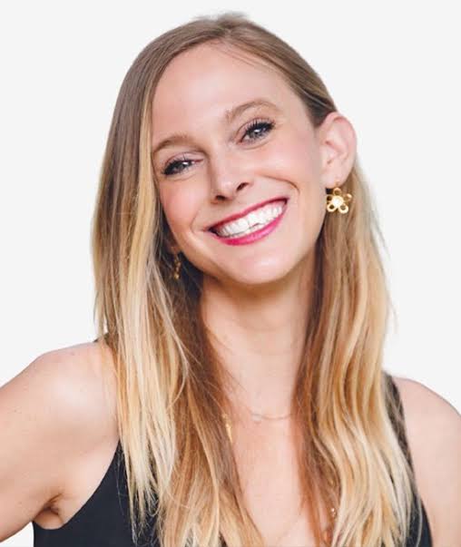Headshot of Andrea Powell, smiling against a light background